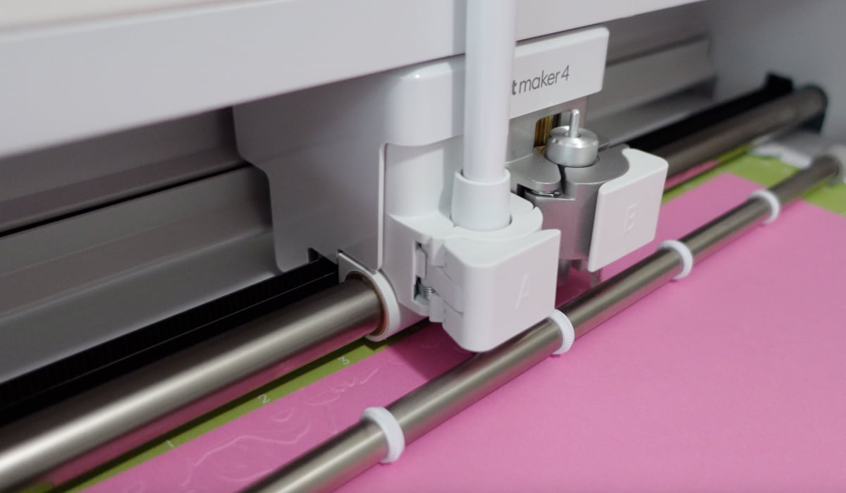 Cricut scoring the paper for an emboss look.