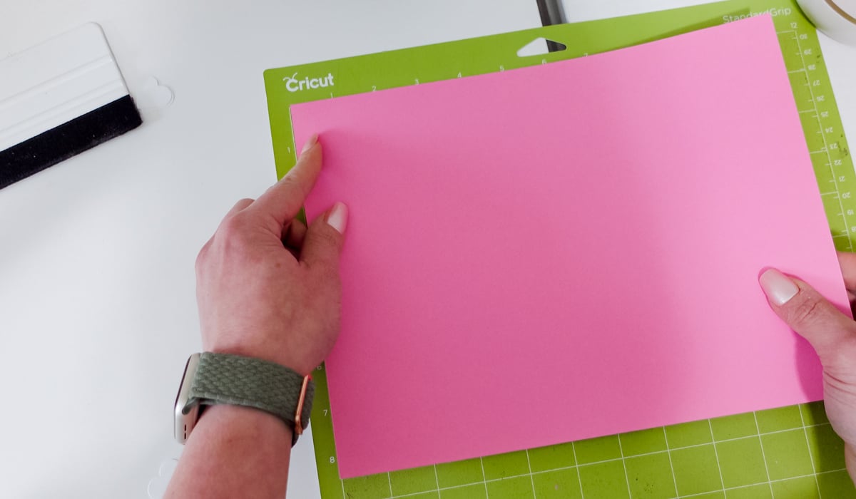 Adding your paper on top for embossing.