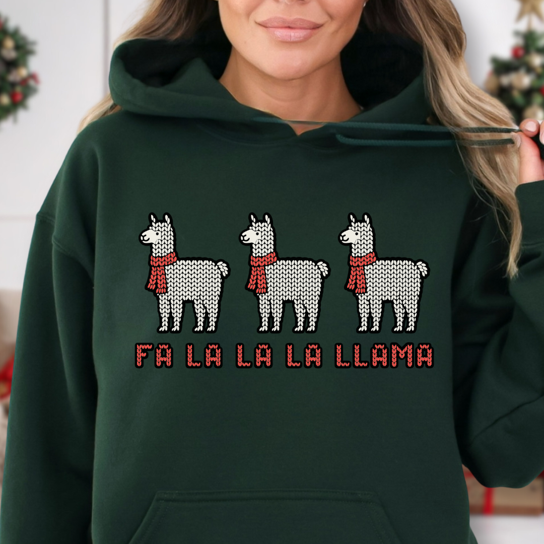 Green hoodie with three white knit-style llamas wearing red scarves and the phrase โFa La La La Llamaโ in red stitched lettering.