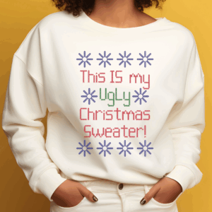 White sweatshirt with colorful stitched text reading This Is My Ugly Christmas Sweater surrounded by blue snowflakes.