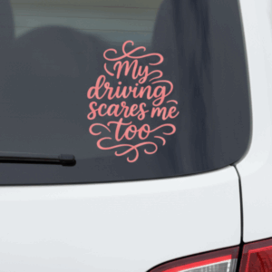 Pink vinyl car decal that reads “My driving scares me too” displayed on the rear window of a white vehicle.