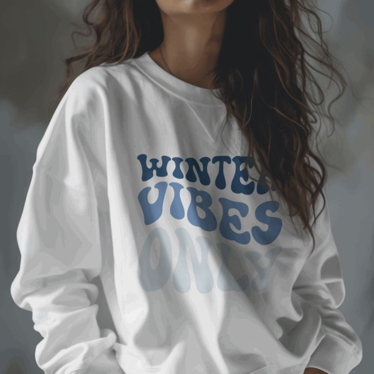 Mockup of a woman wearing a white sweatshirt featuring the “Winter Vibes Only” retro blue bubble-letter SVG design.