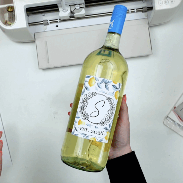 finished cricut wine label with monogram and floral design applied to wine bottle