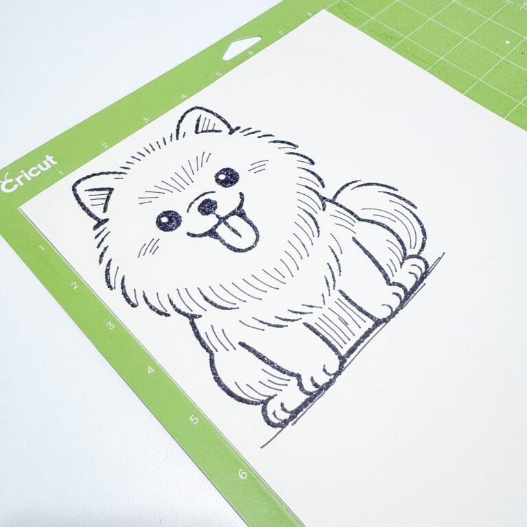 Finished Cricut AI Project Designer pen drawing of pomeranian on cardstock mat.