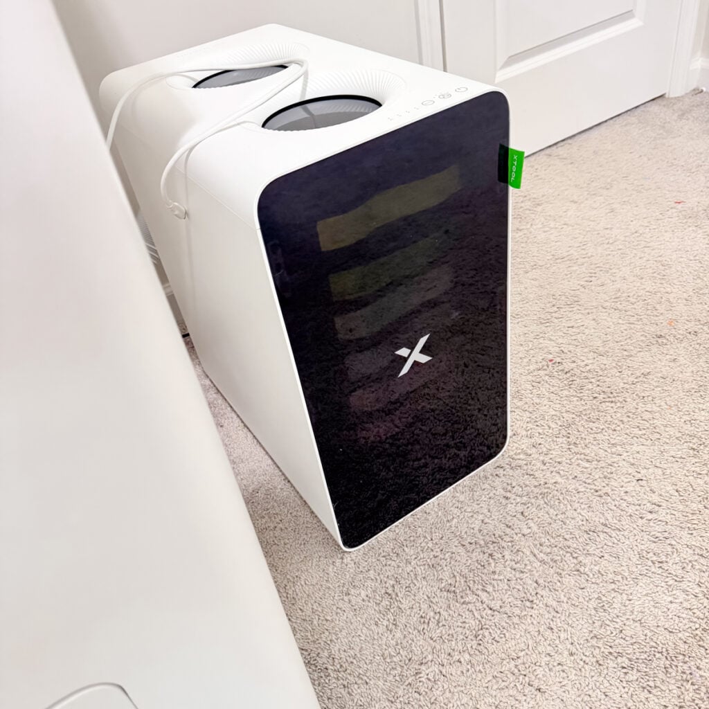 xTool DTF printer air purifier next to machine in home craft room for safe dtf printing