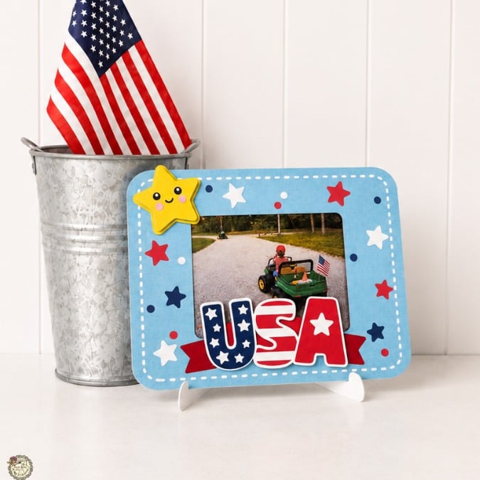 Handmade patriotic USA scrapbook photo frame with layered paper elements.