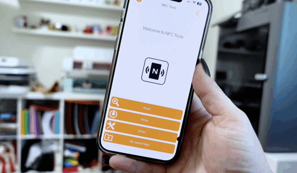 iPhone displaying the NFC Tools app used to program NFC tags for small business marketing and Cricut keychain projects.