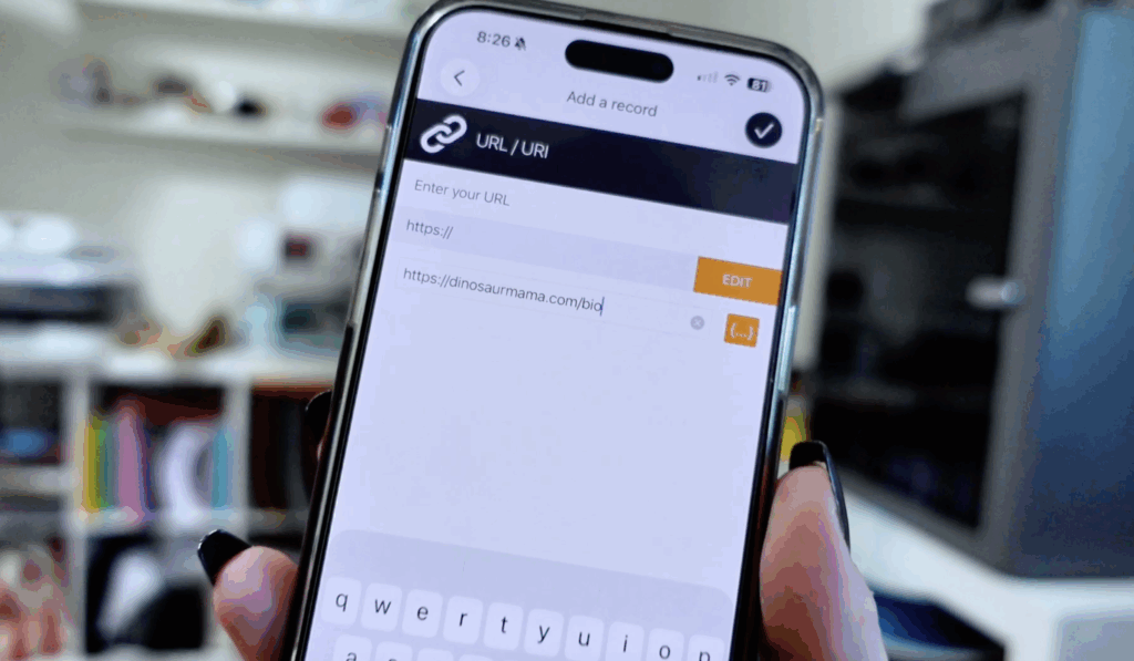 Entering a website URL into the NFC Tools app to program an NFC tag for a small business keychain.